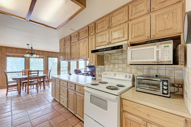 817 Mountain Creek Rd, Marble Falls, TX 78654 - kitchen featuring white appliances, light countertops, tasteful backsplash, under cabinet range hood, and light tile patterned floors