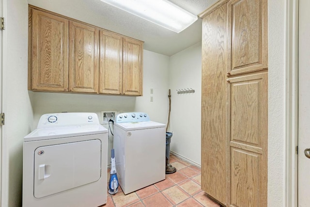 817 Mountain Creek Rd, Marble Falls, TX 78654 - laundry room with cabinet space, washer and clothes dryer, and light tile patterned flooring