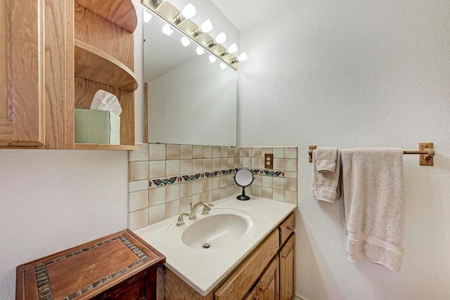 817 Mountain Creek Rd, Marble Falls, TX 78654 - bathroom featuring tasteful backsplash, vanity, and a textured wall