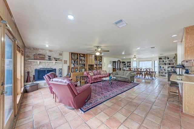 817 Mountain Creek Rd, Marble Falls, TX 78654 - living area with ceiling fan, a stone fireplace, and recessed lighting