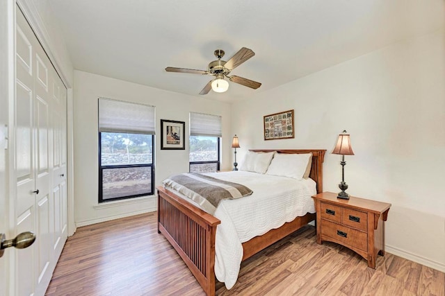 817 Mountain Creek Rd, Marble Falls, TX 78654 - bedroom featuring a closet, light wood-type flooring, and ceiling fan