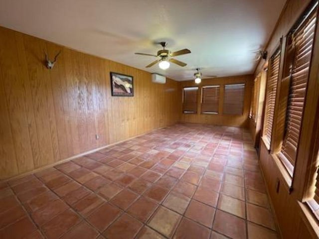 817 Mountain Creek Rd, Marble Falls, TX 78654 - spare room featuring ceiling fan and wooden walls