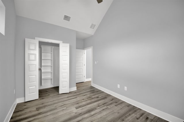 1104 Begonia Ter Unit 2, Austin, TX 78741 - unfurnished bedroom featuring high vaulted ceiling, wood finished floors, a closet, and ceiling fan