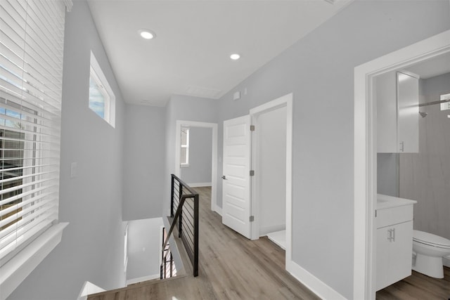 1104 Begonia Ter Unit 2, Austin, TX 78741 - corridor with an upstairs landing, light wood-style flooring, and recessed lighting