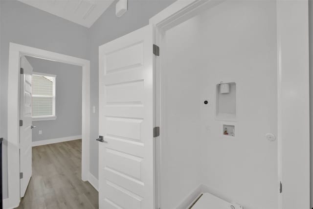 1104 Begonia Ter Unit 2, Austin, TX 78741 - washroom with hookup for a washing machine, hookup for an electric dryer, hookup for a gas dryer, and light wood finished floors