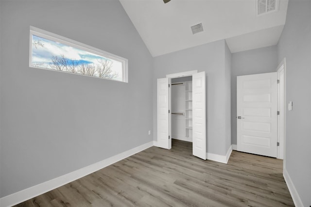 1104 Begonia Ter Unit 2, Austin, TX 78741 - unfurnished bedroom featuring wood finished floors and high vaulted ceiling