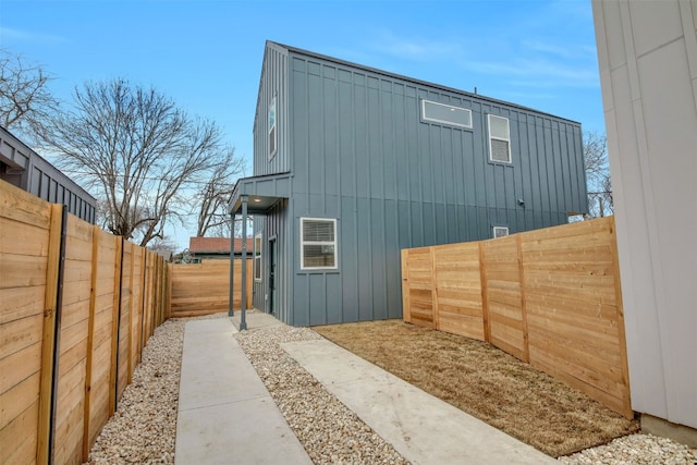 1104 Begonia Ter Unit 2, Austin, TX 78741 - view of property exterior featuring board and batten siding and a fenced backyard