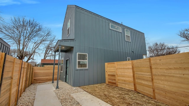 1104 Begonia Ter Unit 2, Austin, TX 78741 - view of side of property featuring board and batten siding and a fenced backyard