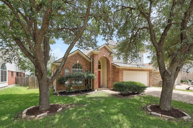 15433 Ozone Pl, Austin, TX 78728 - traditional home with brick siding, concrete driveway, and a garage