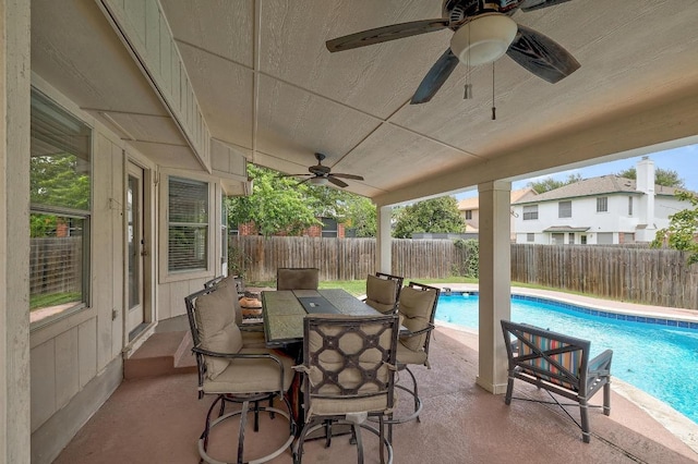 15433 Ozone Pl, Austin, TX 78728 - fenced backyard with a ceiling fan, a patio area, and outdoor dining area