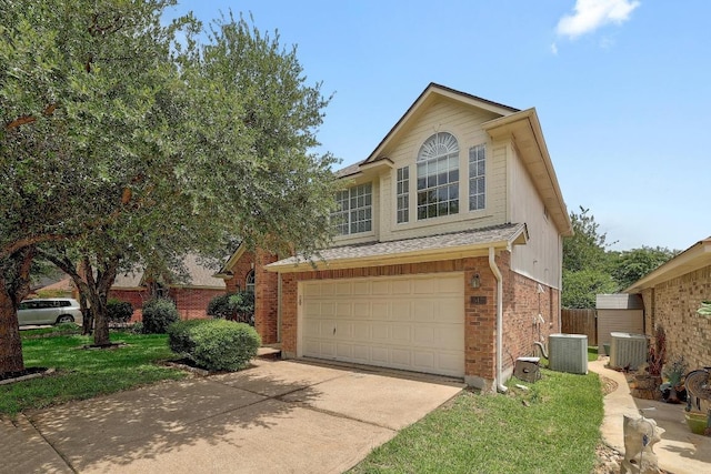 15433 Ozone Pl, Austin, TX 78728 - traditional-style house featuring concrete driveway, a garage, brick siding, and a shingled roof