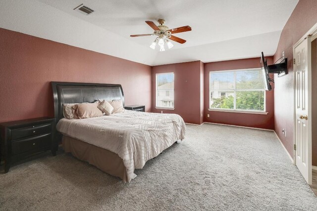 15433 Ozone Pl, Austin, TX 78728 - bedroom with carpet, vaulted ceiling, and a ceiling fan
