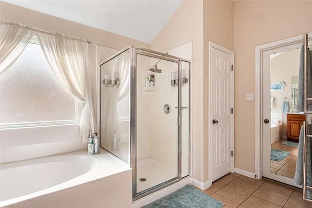700 Stokesay Castle Path, Pflugerville, TX 78660 - bathroom featuring a shower stall, a bath, tile patterned floors, and lofted ceiling