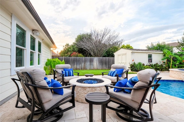 700 Stokesay Castle Path, Pflugerville, TX 78660 - fenced backyard featuring a fire pit, a patio, and a storage unit