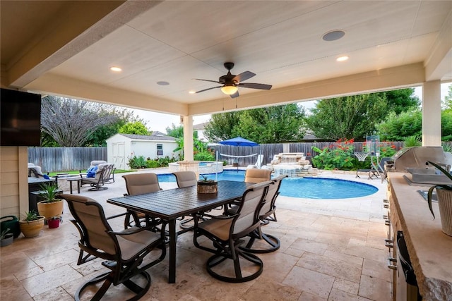 700 Stokesay Castle Path, Pflugerville, TX 78660 - fenced backyard with outdoor dining space, a storage shed, a patio, a ceiling fan, and a grill