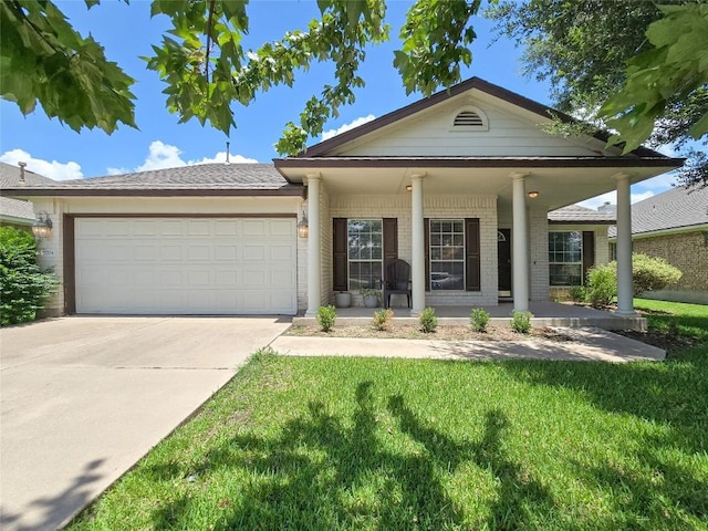 11704 Fletcher Hall Ln, Austin, TX 78717 - view of front of home with an attached garage, brick siding, concrete driveway, and a front yard