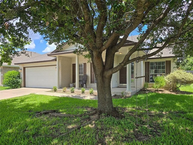 11704 Fletcher Hall Ln, Austin, TX 78717 - view of front of house featuring a porch, an attached garage, concrete driveway, a front yard, and brick siding