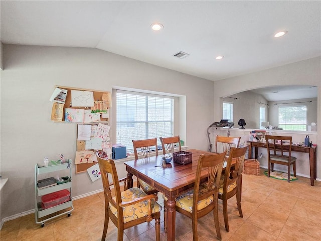 11704 Fletcher Hall Ln, Austin, TX 78717 - dining space featuring arched walkways, recessed lighting, light tile patterned flooring, and lofted ceiling