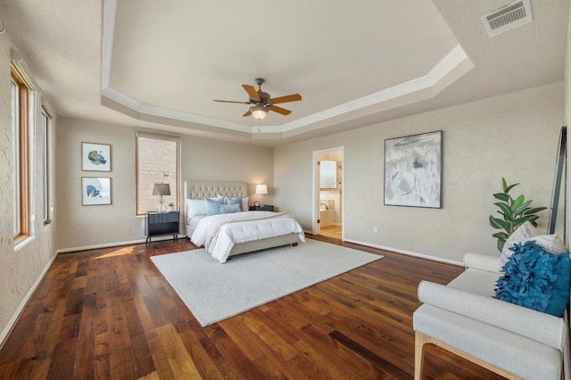 4700 River Place Blvd Unit 3, Austin, TX 78730 - bedroom with a tray ceiling, dark wood finished floors, ornamental molding, a ceiling fan, and connected bathroom