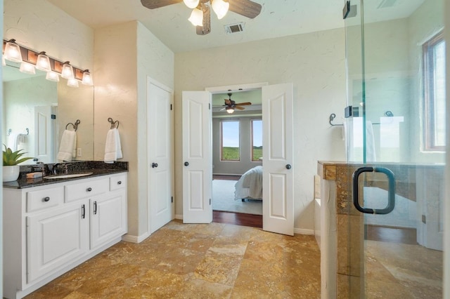 4700 River Place Blvd Unit 3, Austin, TX 78730 - bathroom featuring a ceiling fan, connected bathroom, vanity, and plenty of natural light