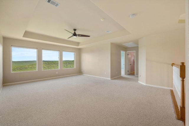 4700 River Place Blvd Unit 3, Austin, TX 78730 - unfurnished room with a tray ceiling, light colored carpet, and a ceiling fan