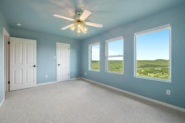 4700 River Place Blvd Unit 3, Austin, TX 78730 - unfurnished bedroom featuring carpet flooring, ceiling fan, and a closet