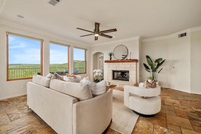 4700 River Place Blvd Unit 3, Austin, TX 78730 - living room featuring stone tile flooring, healthy amount of natural light, ornamental molding, and arched walkways