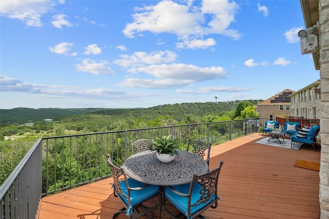 4700 River Place Blvd Unit 3, Austin, TX 78730 - wooden deck featuring a wooded view and an outdoor living space