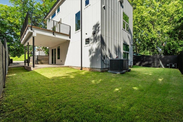 2902 Gonzales St Unit 2, Austin, TX 78702 - back of house featuring a balcony, a patio, a fenced backyard, and board and batten siding