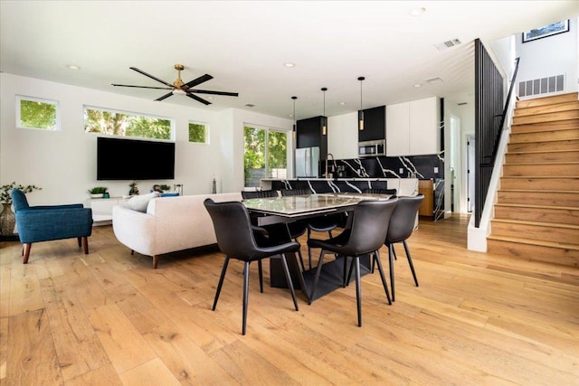 2902 Gonzales St Unit 2, Austin, TX 78702 - dining area featuring light wood-style floors, stairway, recessed lighting, and a ceiling fan