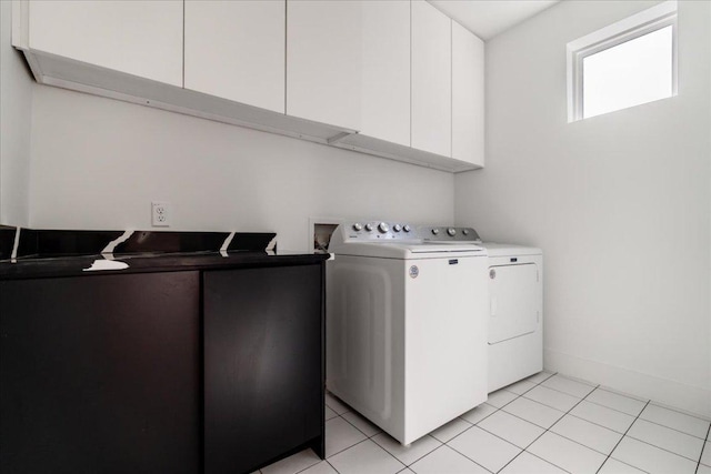 2902 Gonzales St Unit 2, Austin, TX 78702 - laundry room featuring washing machine and dryer, cabinet space, and light tile patterned floors