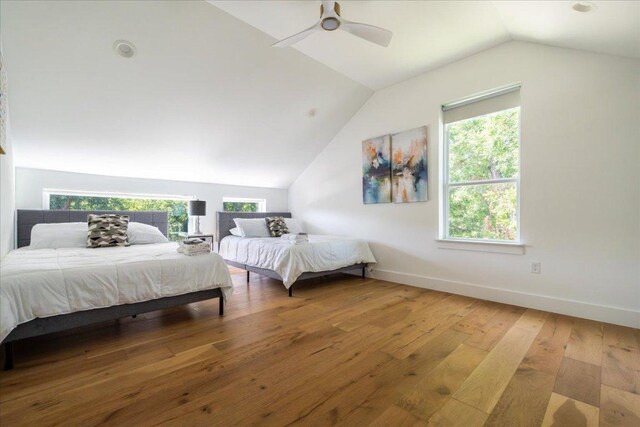 2902 Gonzales St Unit 2, Austin, TX 78702 - bedroom with vaulted ceiling, multiple windows, wood-type flooring, and a ceiling fan