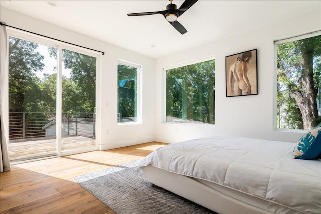 2902 Gonzales St Unit 2, Austin, TX 78702 - bedroom featuring access to exterior, wood finished floors, and ceiling fan