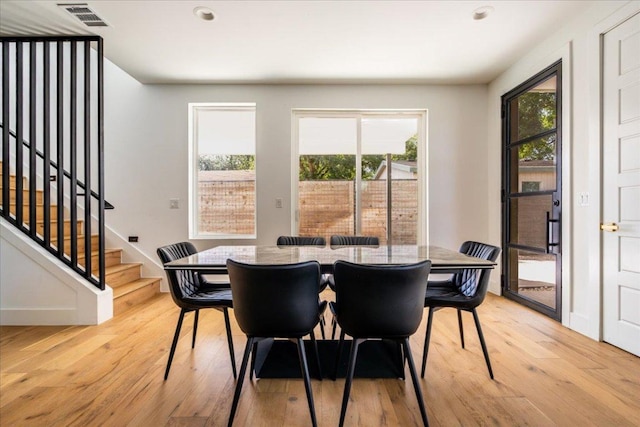 2902 Gonzales St Unit 2, Austin, TX 78702 - dining space featuring light wood-style flooring, stairs, and recessed lighting