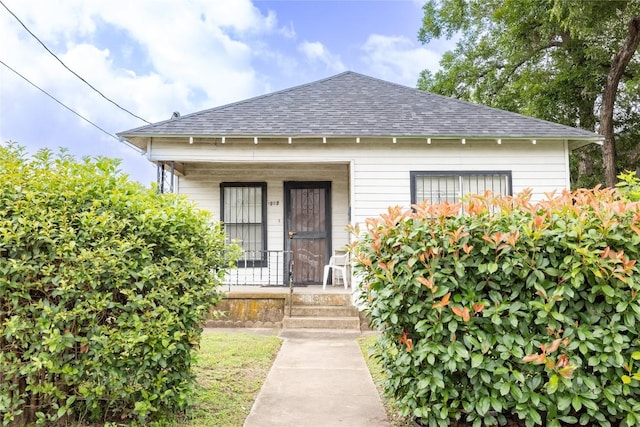 1909 E 14th St, Austin, TX 78702 - entrance to property featuring roof with shingles and a porch