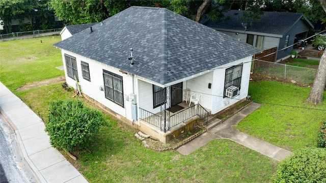 1909 E 14th St, Austin, TX 78702 - rear view of property featuring roof with shingles and a porch