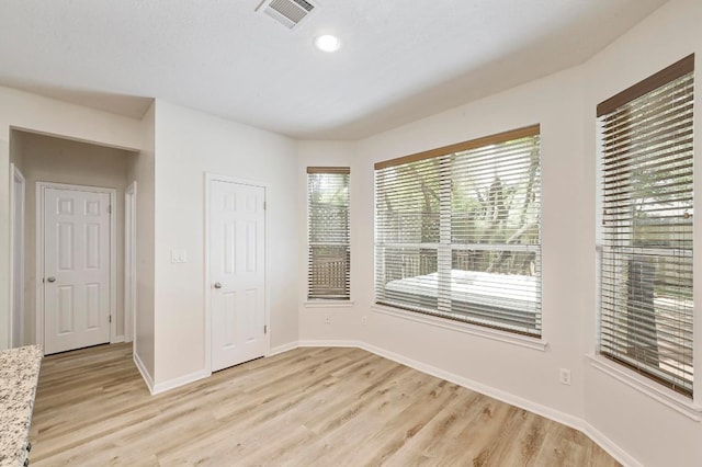 12600 Grimes Ranch Ct, Austin, TX 78732 - spare room with light wood-style floors and recessed lighting