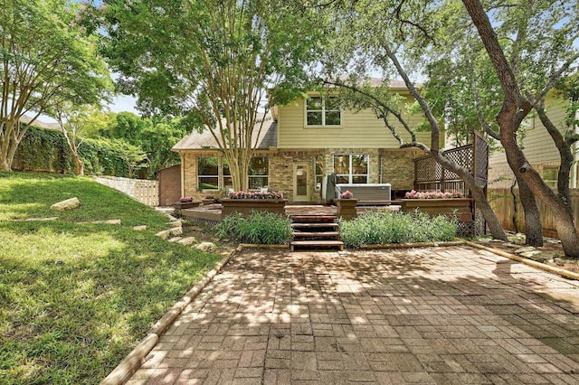 12600 Grimes Ranch Ct, Austin, TX 78732 - rear view of property featuring brick siding and a deck