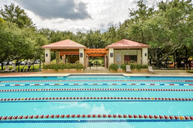 12600 Grimes Ranch Ct, Austin, TX 78732 - community pool featuring view of wooded area