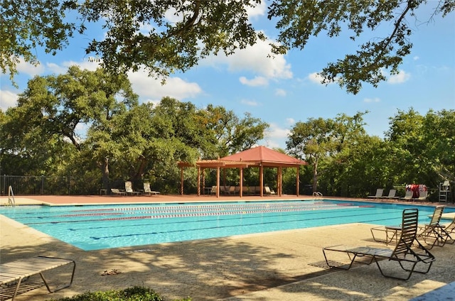 12600 Grimes Ranch Ct, Austin, TX 78732 - community pool featuring a gazebo, view of wooded area, and a patio area