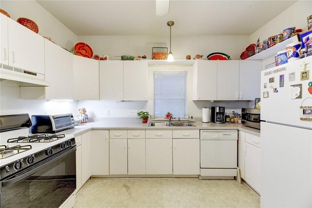 kitchen with white appliances, sink, white cabinetry, and light tile flooring