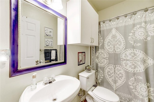 bathroom featuring sink and toilet