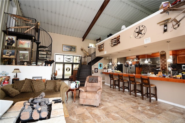 living room featuring high vaulted ceiling, indoor bar, and beam ceiling