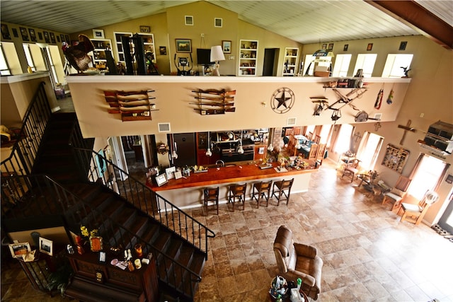 interior space with high vaulted ceiling and a wealth of natural light