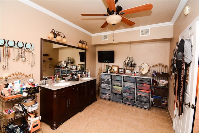 interior space featuring crown molding, dark brown cabinets, ceiling fan, and sink