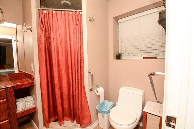 bathroom with vanity, toilet, tile patterned floors, and a shower with curtain