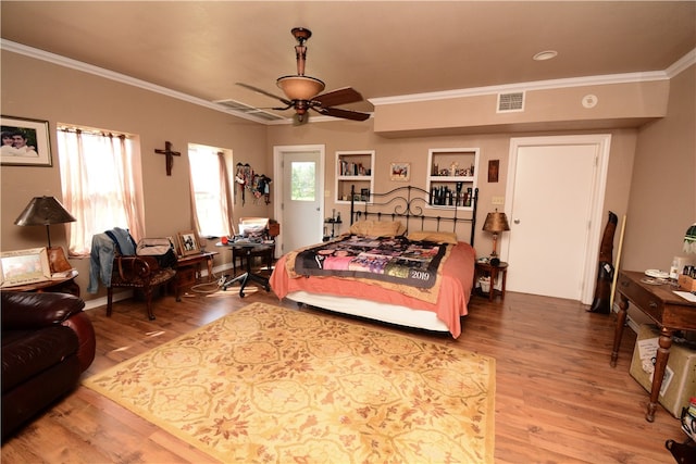 living room featuring ornamental molding, ceiling fan, and hardwood / wood-style flooring