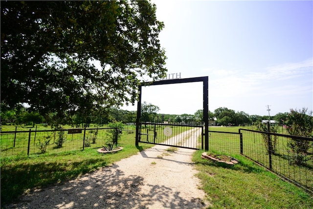 exterior space with a yard and a rural view