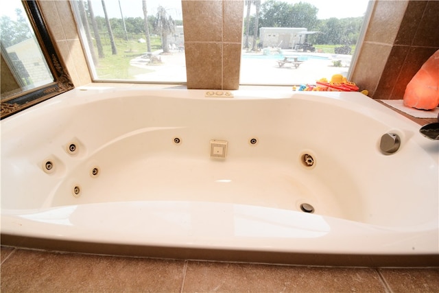 bathroom featuring a bathing tub and tile patterned flooring