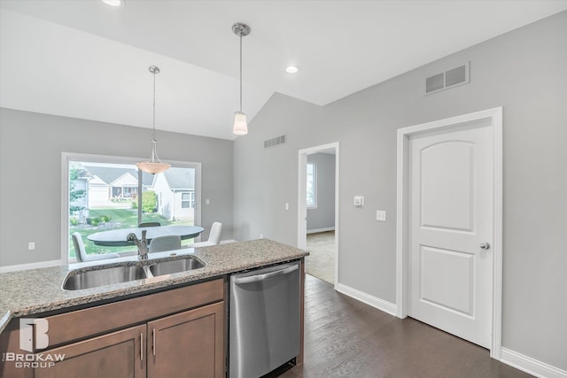 kitchen featuring hanging light fixtures, lofted ceiling, dishwasher, dark hardwood / wood-style flooring, and light stone countertops